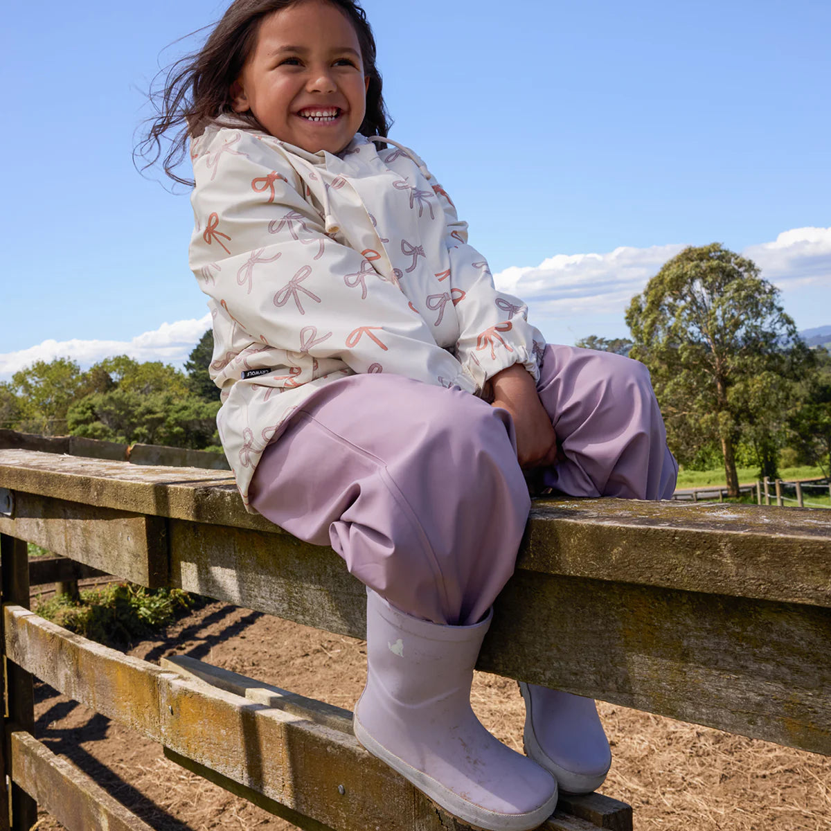 Child wearing Crywolf Rain Boots Heather outdoors