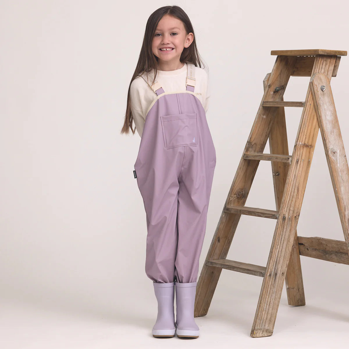 Child wearing Crywolf Rain Overalls Heather