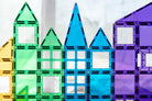 Children building structures with Connetix magnetic tiles