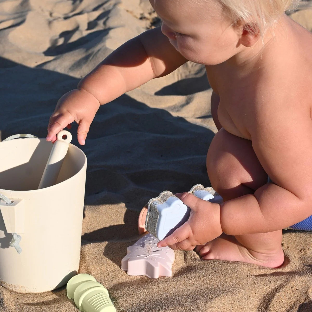 Apple Sorbet silicone bucket and spade from Sunnylife for kids beach and sand play