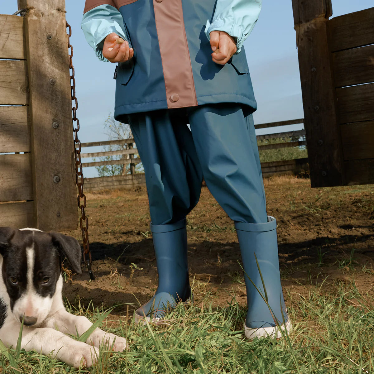 Child wearing Crywolf Rain Boots Highland Blue outdoors