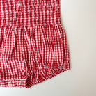 Cherry red shirred romper close up of snap crotch 