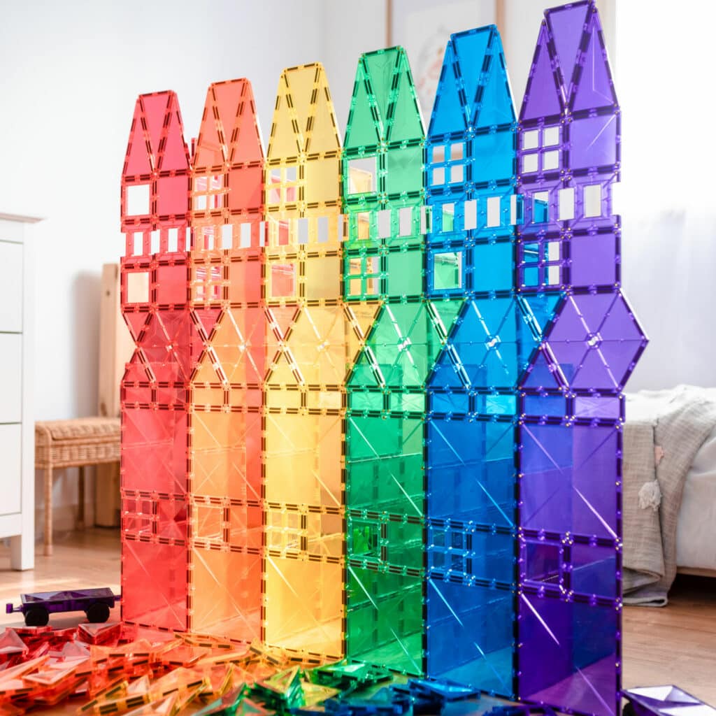 Children building structures with Connetix magnetic tiles