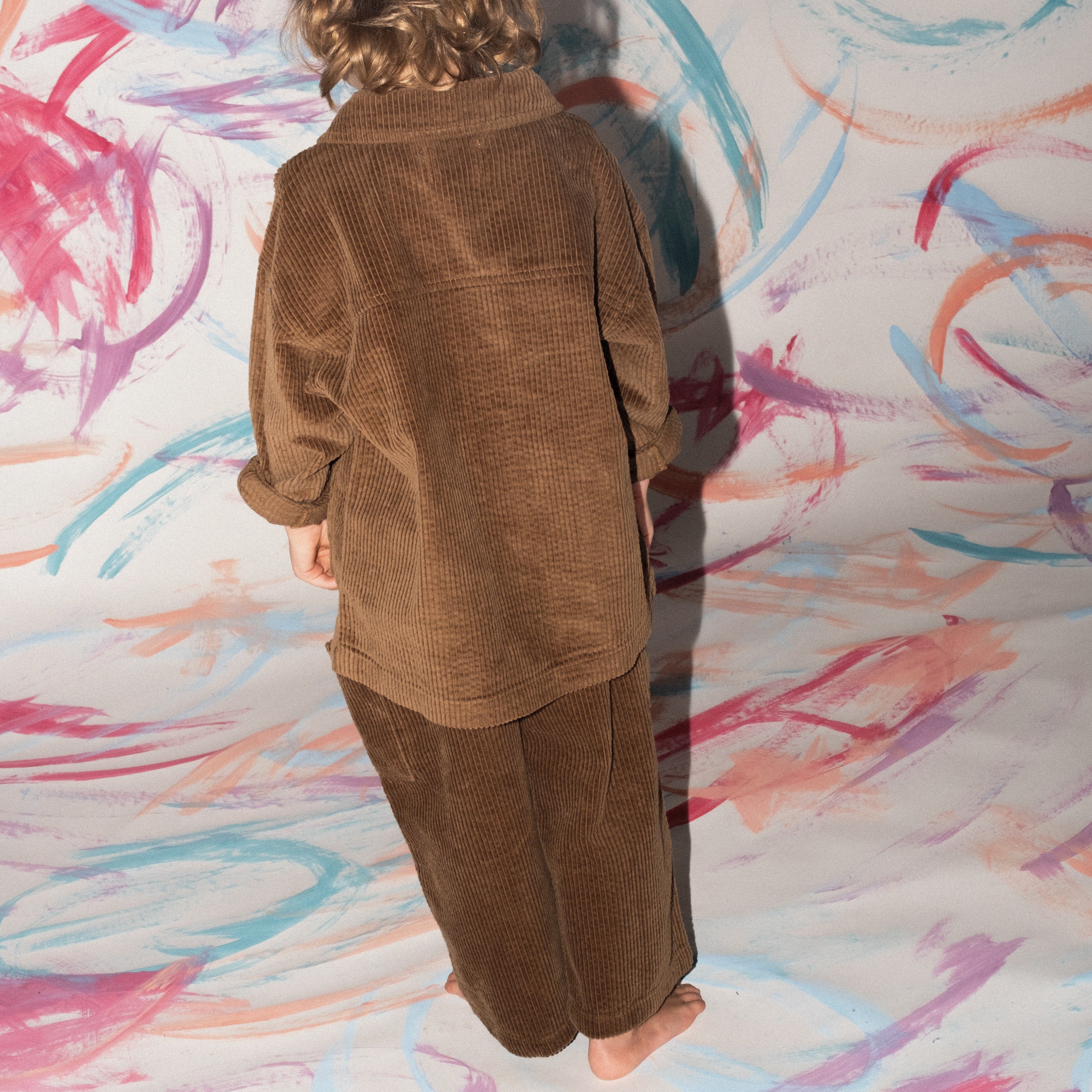 Organic cord pants in espresso colour, back view