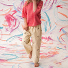 Close-up of wild flower embroidery detail on organic denim