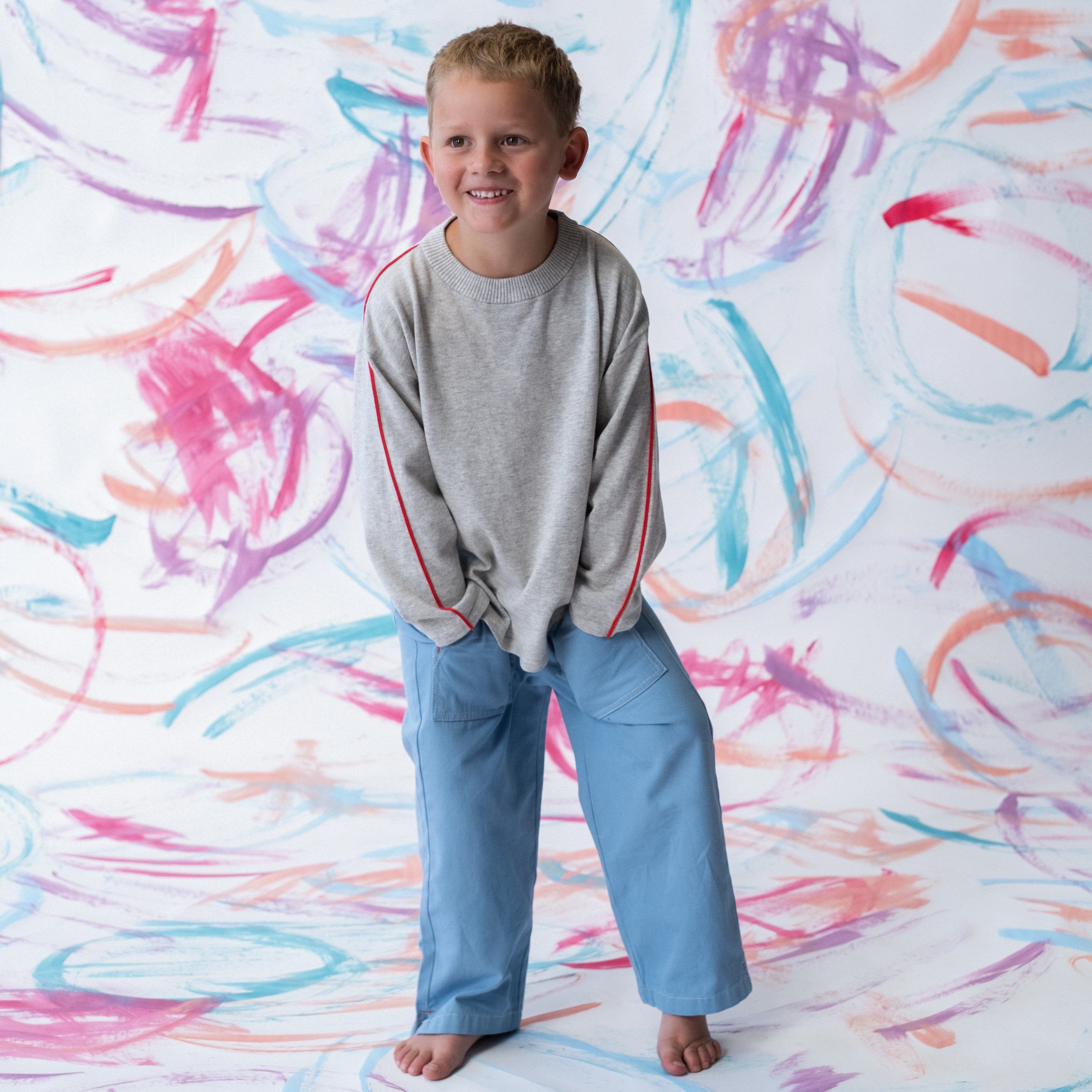 Exposed seam detail at sleeve head on grey marle long sleeve tee