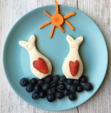 Lunch Punch Mermaid Cutter in use making a sandwich fish tail cutter