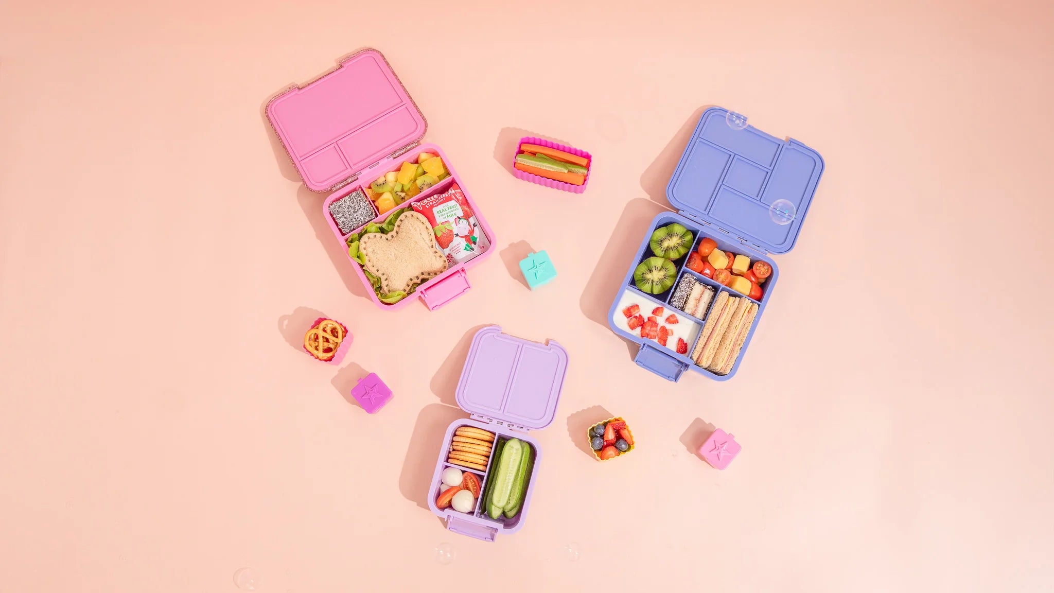 Inside view of MontiiCo Bento Three Floss Glitter lunchbox showing leakproof compartments
