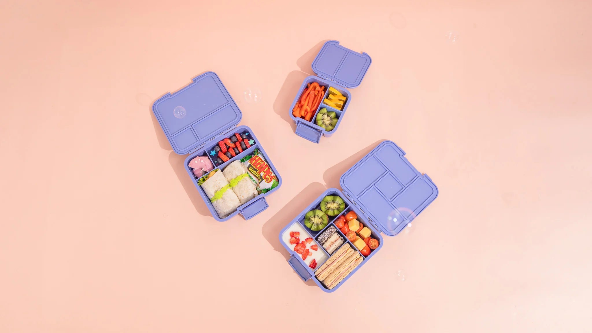 MontiiCo Bento Three Splash lunchbox open showing three compartments and easy-open latch