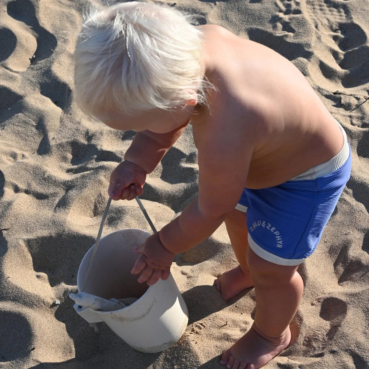Apple Sorbet silicone bucket and spade from Sunnylife for kids beach and sand play