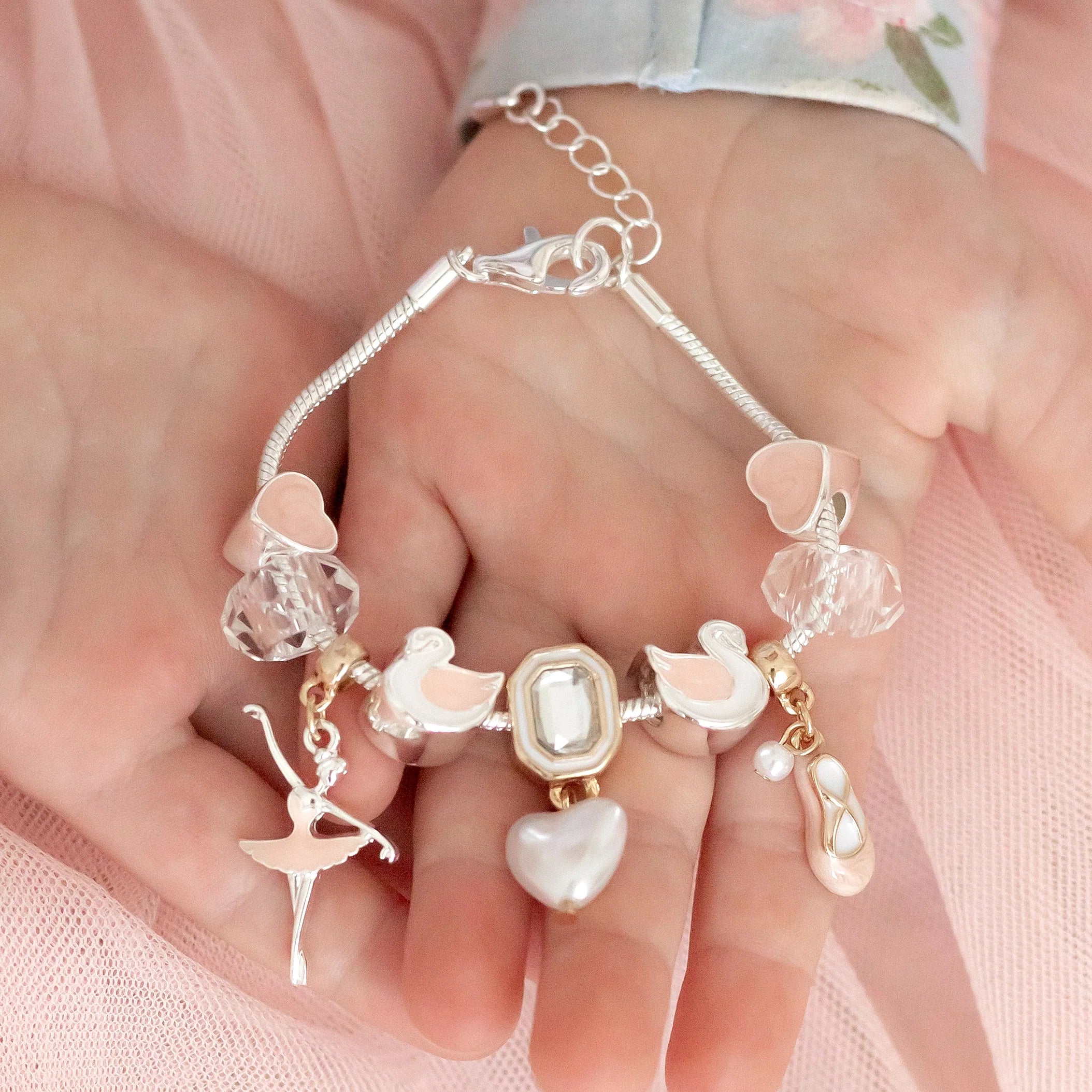 Lauren Hinkley Swan Lake Charm Bracelet featuring Princess Odette, two swan maidens, and a pearl-like heart charm – children’s jewellery gift